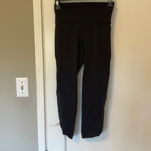 Cropped Black Lululemon leggings with sheer detail
